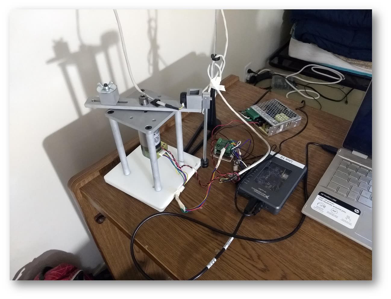 The physical system — motor, cart, rod and encoder.